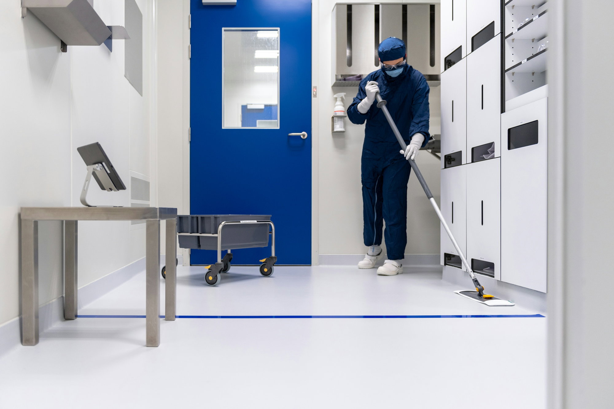 a-person-in-a-blue-mask-and-a-mask-holding-a-ladder.jpg a person in a blue mask and a mask holding a ladder